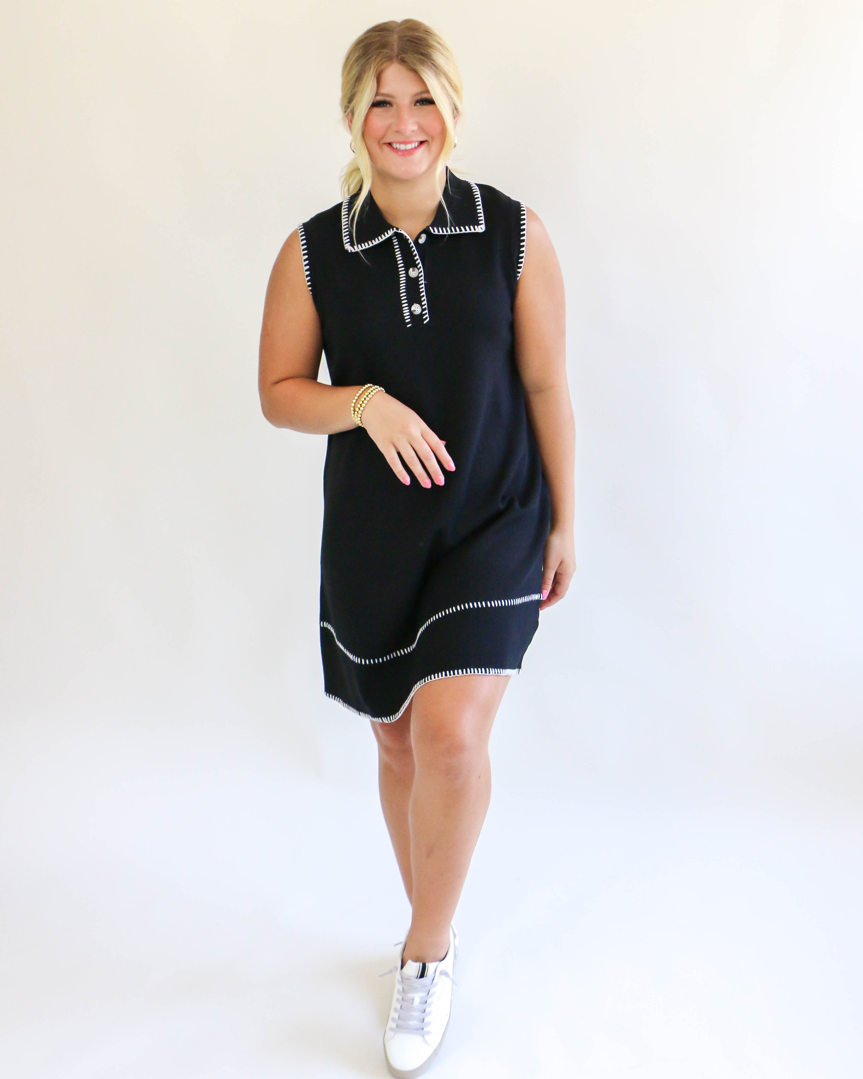 Collared sleeveless black dress with cream trim